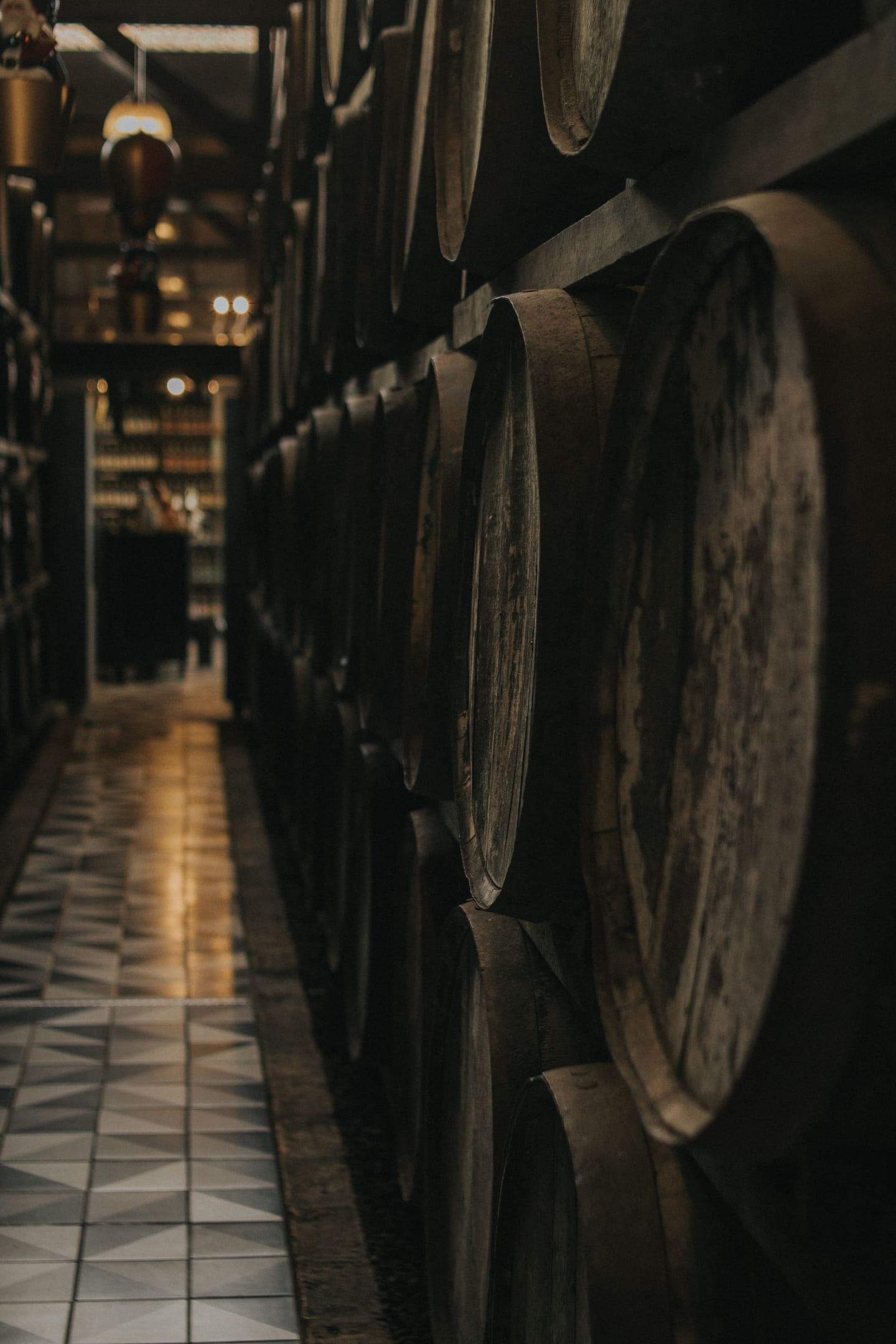Oak barrels age in the estate's dark cellar